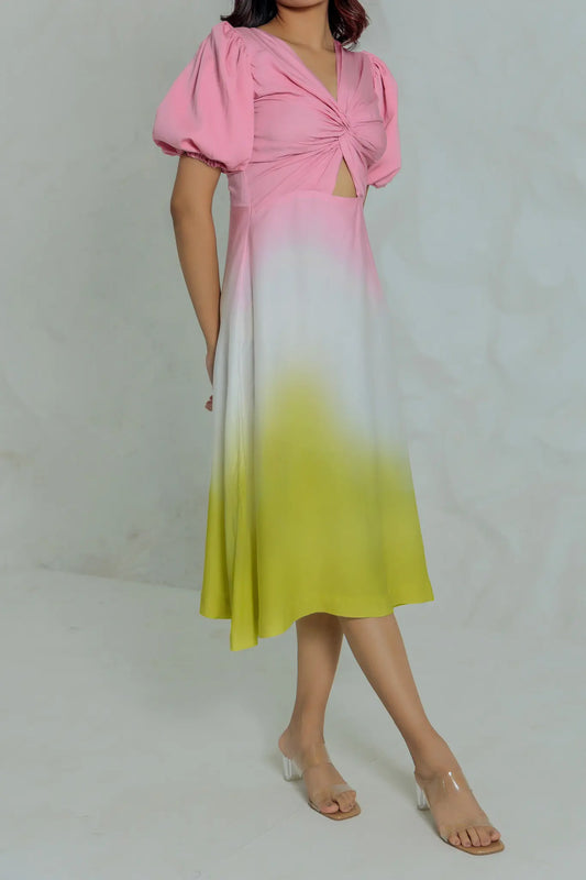 ide angle view of model wearing the Lime Blush midi dress showing the pink to lime green ombre gradient.