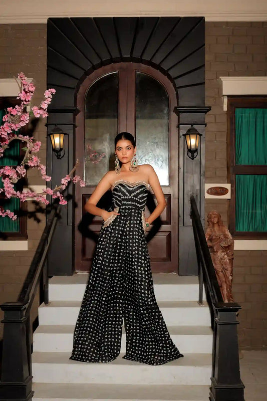 Tea & Dove Zayra black silk strapless jumpsuit featuring traditional Jaipuri tie and dye print and wide leg silhouette.